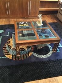 Modern geometric area rug, traditional coffee table, Venetian glass harlequin