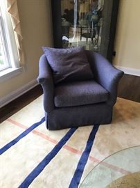 one of a pair of blue swivel chairs