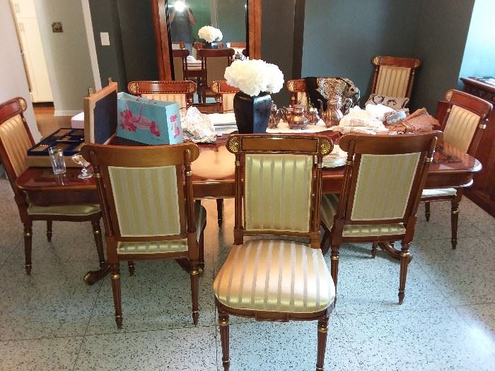 Italian Lacquer dinning room table with 12 chairs. satin material on chairs. 