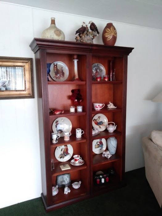 Wood book shelf with collector plates.