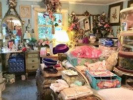 Hats, linens, art, blonde furniture suite