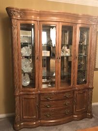Bernhardt China Buffet/Cabinet with 3 glass shelves , 3 interior Recess lights, and mirror backing. 3 drawers total. Top drawer is lined in velvet with dividers for Flatware. 2 Side cabinets with 1 shelf. Approximately 68 inches wide, Height  89 inches, & Depth 16 3/4 inches. Items inside Not Included! 