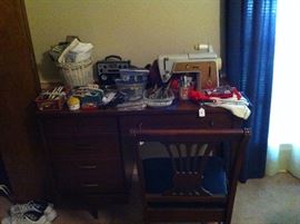 Sewing machine in cabinet, sewing supplies