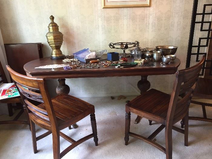 Dining Room Table with two leaves and four chairs.
