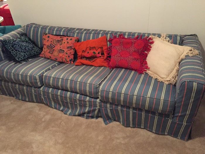 Striped Sofa with assorted pillows.