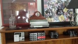 Golf ball display and Pittsburgh Steelers framed art.