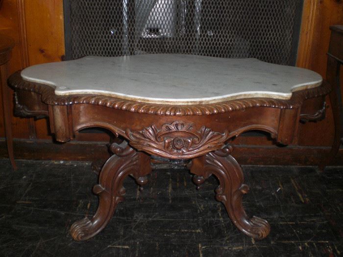 Rococo Revival rosewood nicely carved table with scalloped apron and inset marble top