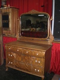 Tiger oak dresser with mirror and claw feet as part of a 2piece bed set