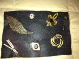 Collection of gold-toned pins