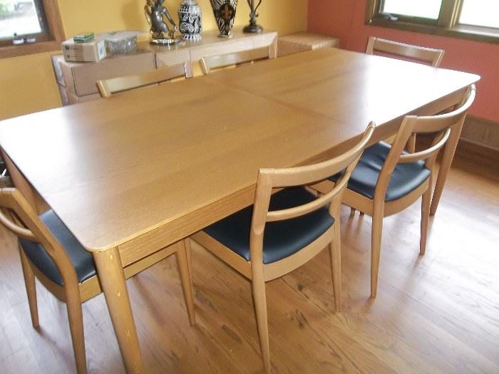 Table has 8 Chairs and 1 leaf inside