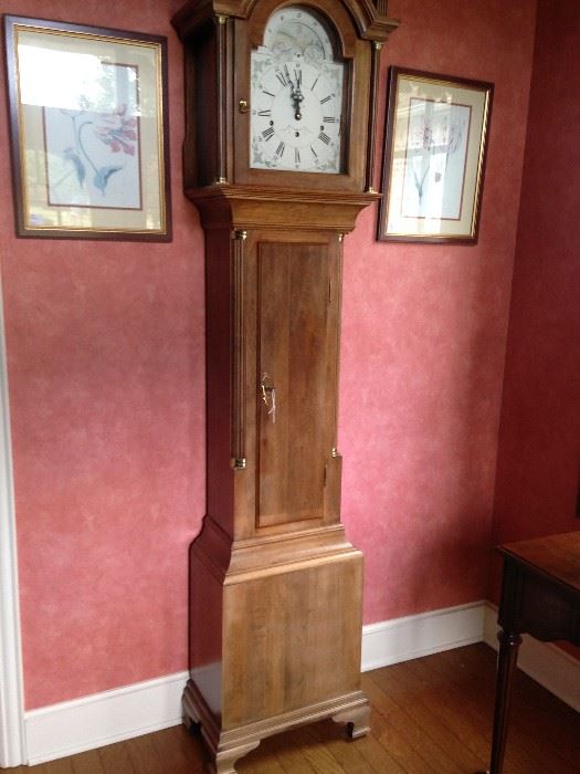 A "striking" grandfather clock is in the entry of the home.