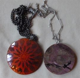 Two large pendant necklaces, one with purple stone
