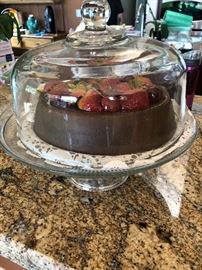 Faux cake under glass dome 