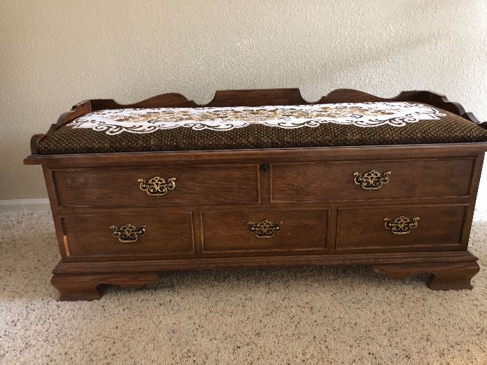 Beautiful wooden cedar chest with built in seat cushion. Been in family for 50 years. Needs a little TLC to freshen it up. great storage in any bedroom or basement. 