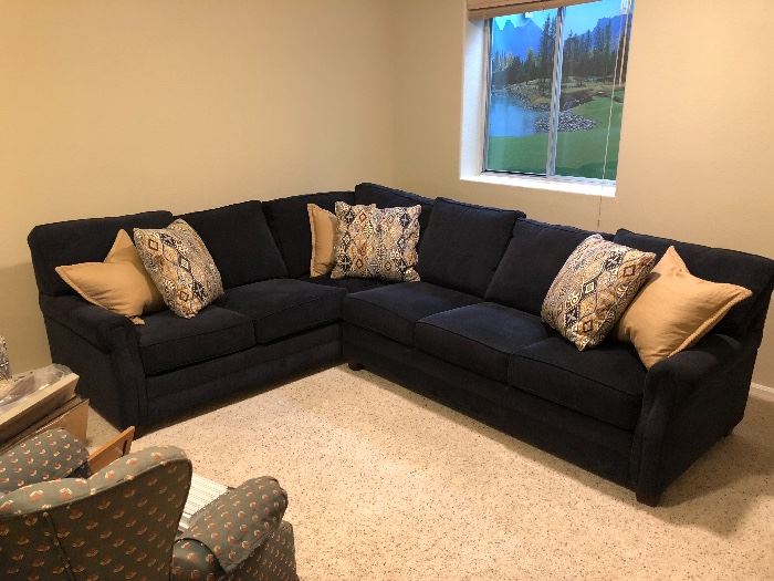 Nearly new navy blue corduroy sectional perfect for a great room or large living room or den. Measures 36 inches high, 30 inches deep and 100 inches long and 76 inches long. 