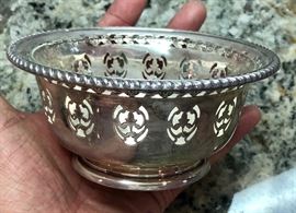 Pierced sterling silver bowl made by Birks in Montreal. Features clear glass insert.