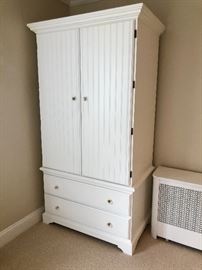 White beadboard armoire featuring two lower drawers