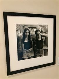 "Two Girls by the Truck" by photographer Jack Montgomery. Gelatin Silver Print. Printed by the artist. Image size: 14.5 x 14.5: Framed size: 25.5 x 25.5: Signed, dated and editioned on verso, lower right. Edition 3/50.