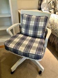 White office swivel chair with custom cushions.