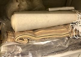 Rugs, clean and rolled.