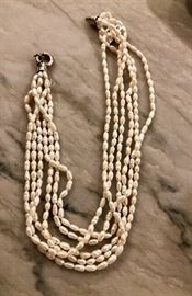 Seed pearl strands with sterling clasp