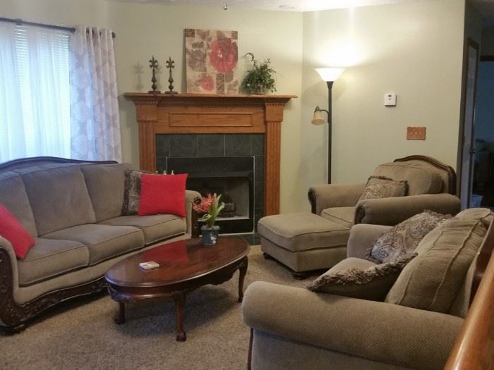 Matching sofa, loveseat, chair and ottoman.  Oval cherry coffee table.