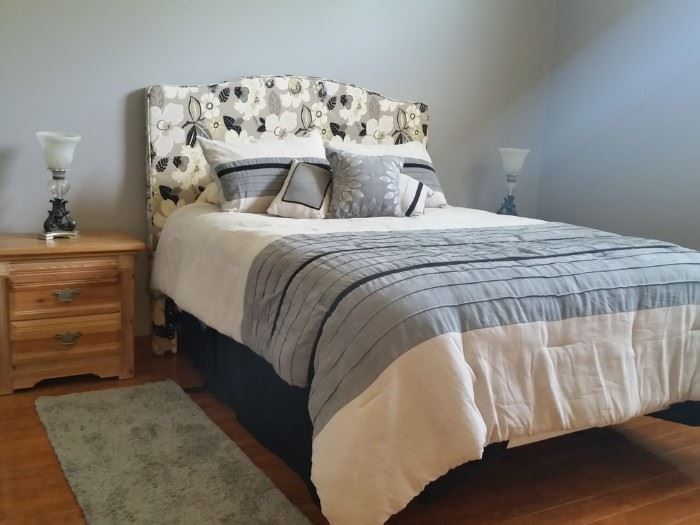 This queen-size bed has a padded headboard, Sealy 'Posturpedic' pillowtop mattress, and adjustable power base foundation.  Seller paid well over $2K for the mattress and base.  One of two matching nightstands.