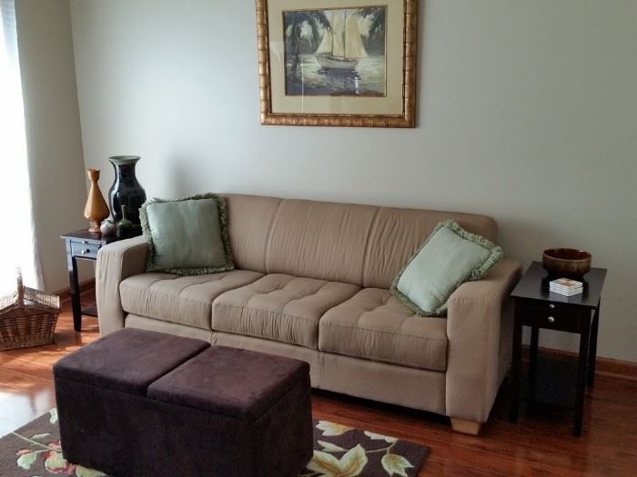The sofa is about seven feet long.  The two end tables match another one in an earlier photo.  The ottoman opens for storage.