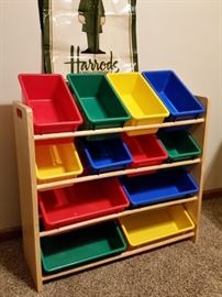 Wood rack with plastic storage bins for toys