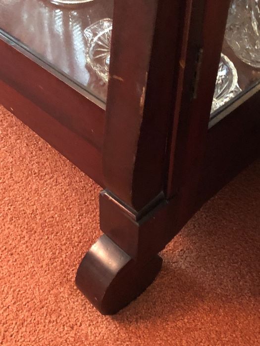 Detail of scroll feet of china cabinet