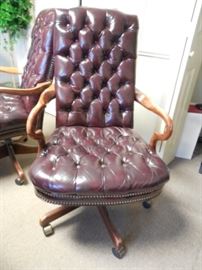 $245 each Burgundy leather office chairs with wood arms (2 available)