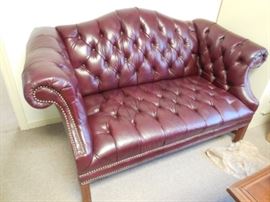 $450 Burgundy leather loveseat