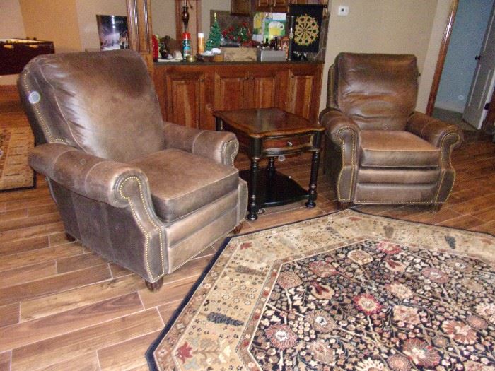 Two matching Leather Motion Craft by Sherrill three way low leg recliner with nail head trim  fully reclining chairs OUR PRICE $300.00 EACH, beautiful area rug and one of two Seven Seas by Hooker end tables with drawer $75.00 each