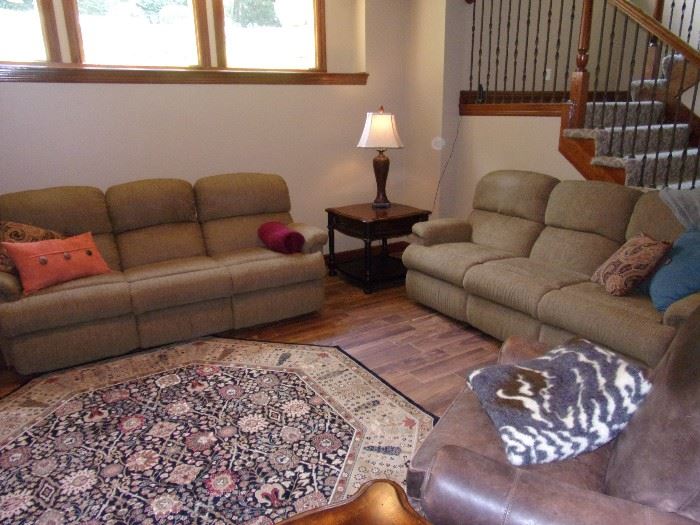 Two matching Flexsteel dual wall hugger reclining sofas/couch quality excellent condition and clean! #350.00 each Beautiful area rug and one of two Seven Seas by Hooker end tables with drawer!