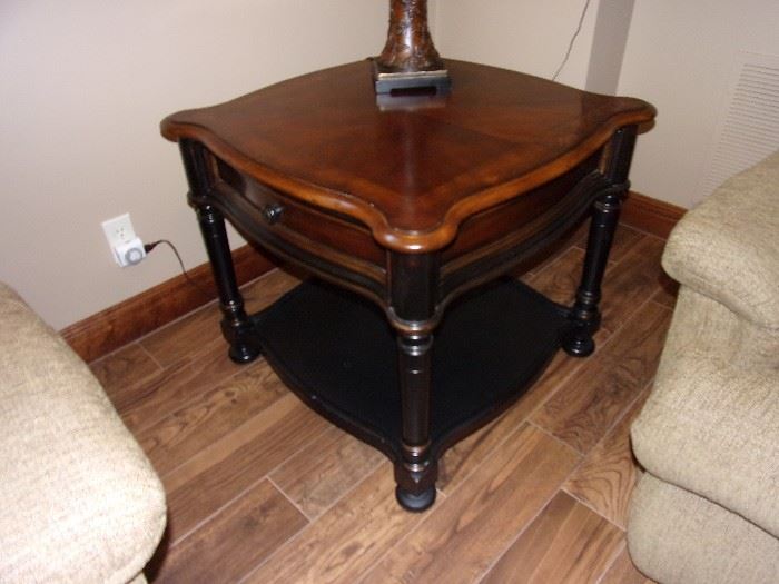 One of two Seven Seas by Hooker end tables with drawer