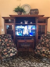 5 piece tv entertainment wall unit - the top comes off, the 2 end cabinets are separate (with the glass doors), the middle piece that the tv is on is completely separate so it doesn't matter what size tv you have it WILL fit and the stand the tv is on was custom made!  