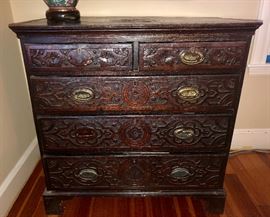 Heavily carved antique bureau