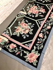 Pink and black needlepoint rug from Domain
