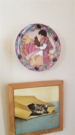 Lots of wall art and decorative plates