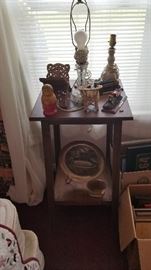 Bedside table, lamp, and knick knacks