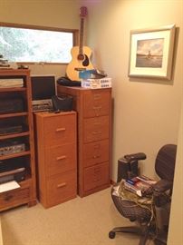 Tall Antique Oak File Cabinet wit Brass Name Plates; Task Chair; Oil Painting by Teipel; Acoustic Guitar with Case; Computer and Wireless Speaker