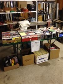 Large collection of like new and some still in plastic VHS tapes, books and product.