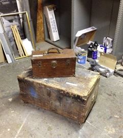 Old tool chest on metal wheels and oak tool box.