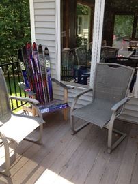 Repurposed snow skis into Adirondack chair.... We also have a plain white one!