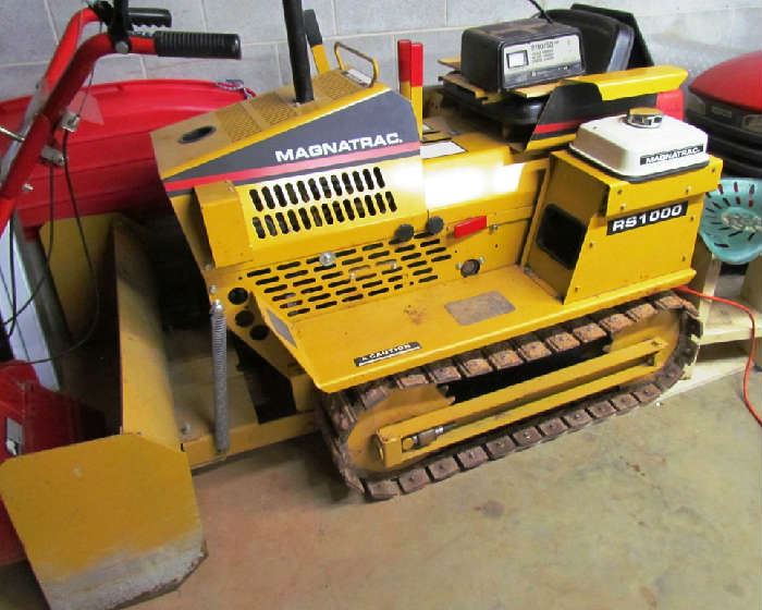 Struck Magnatrac RS 1000, with front blade attachment, plow and towing attachments