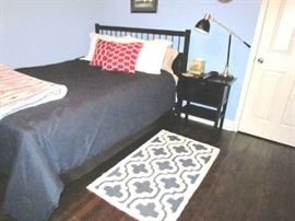 "Mission" style bed set, with extra trundle underneath and an additional mattress in closet