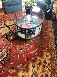 Room area size carpets in brilliant colors.  Glass top and iron, oval table (suitable for livingroom/family room.