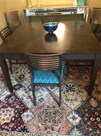 Square dining room table, fitting 8 chairs, which are available.  Perfect for a townhouse dining room.  All furniture is in immaculate condition!