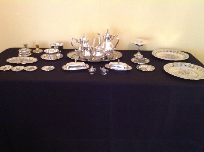 Silver tea set and serving pieces.