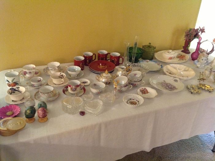 Vintage dishes and several porcelain tea sets.
